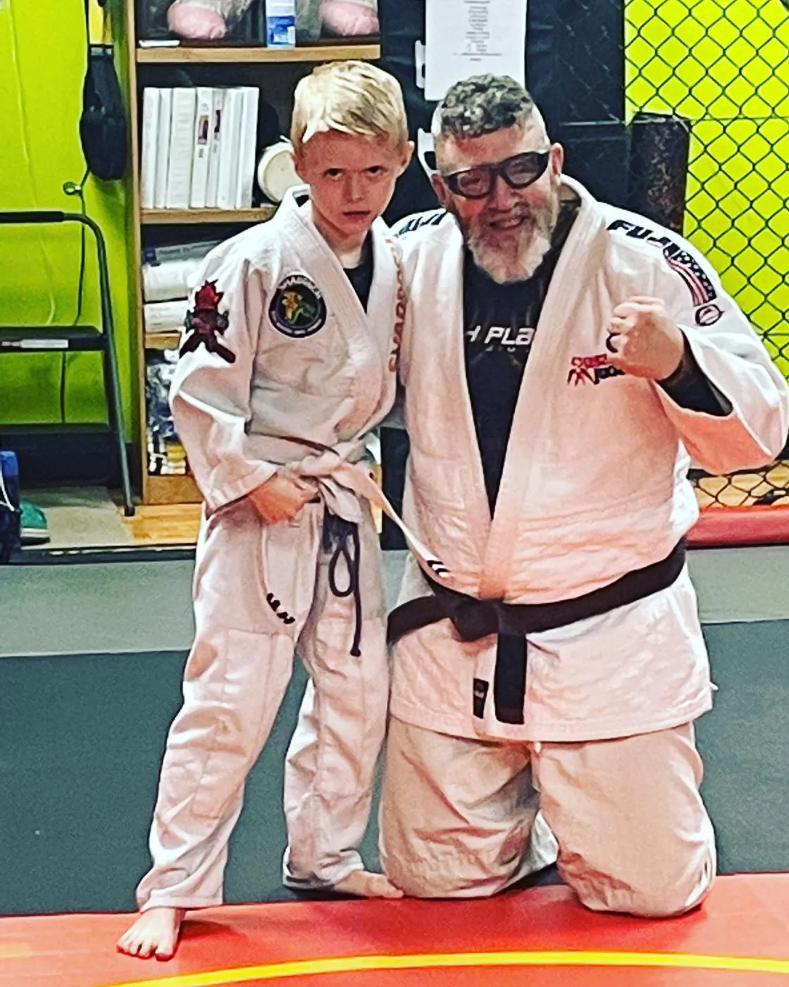 John Shaddock teaching a kid juijitsu